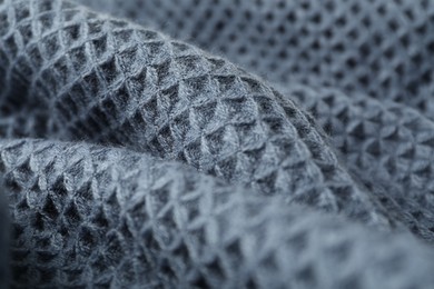 Photo of Texture of blue knitted fabric as background, closeup