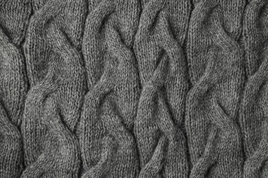 Texture of grey knitted fabric as background, top view