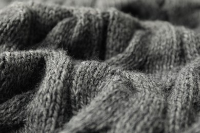 Photo of Texture of grey knitted fabric as background, closeup