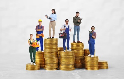 Image of People of various professions on stacks of coins of different height against white background