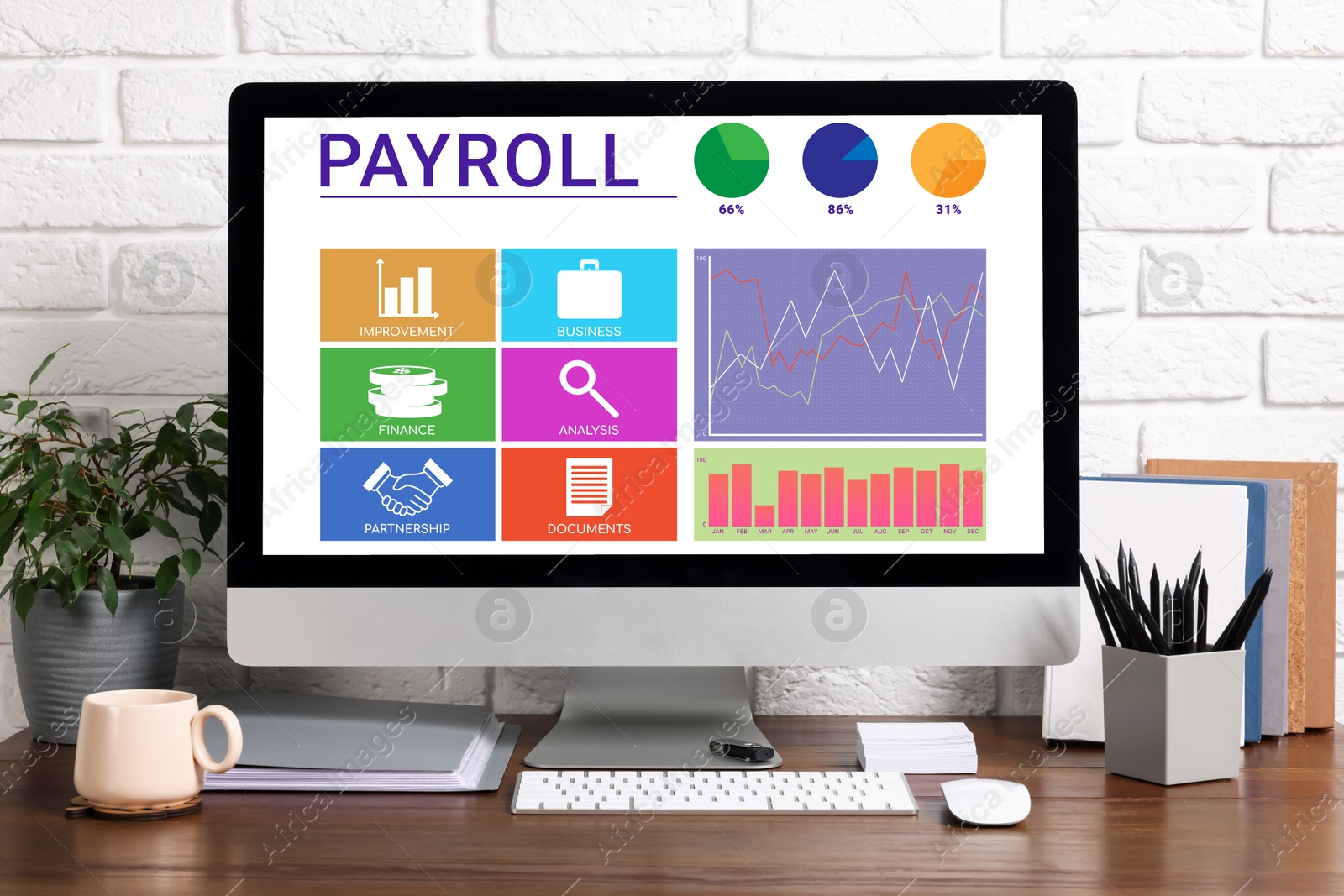 Image of Computer screen with payroll data on table