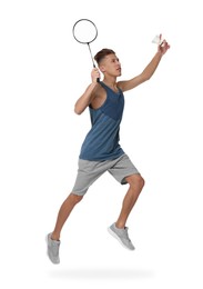 Image of Young man playing badminton with racket and feather shuttlecock on white background