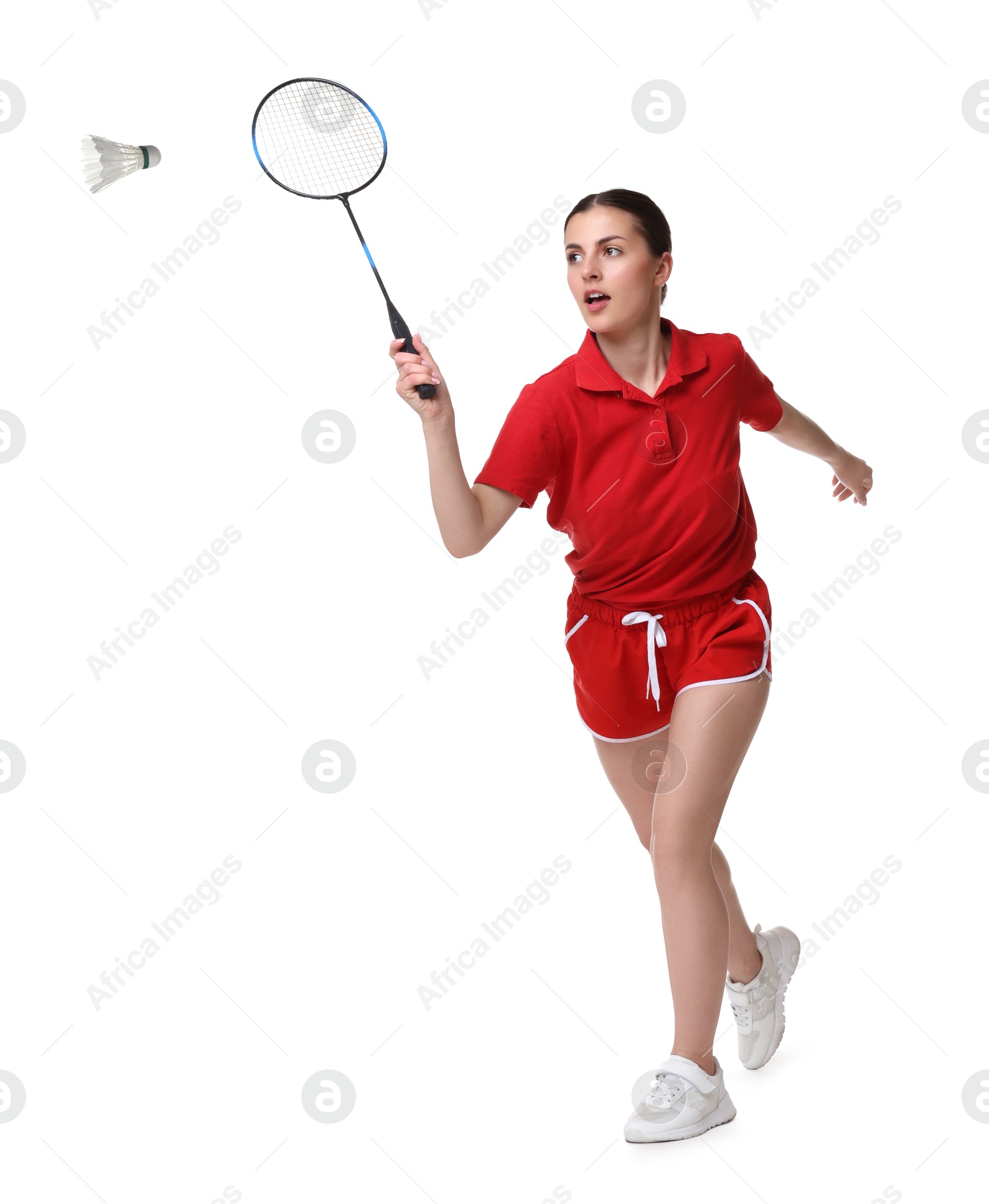 Image of Young woman playing badminton with racket and feather shuttlecock on white background