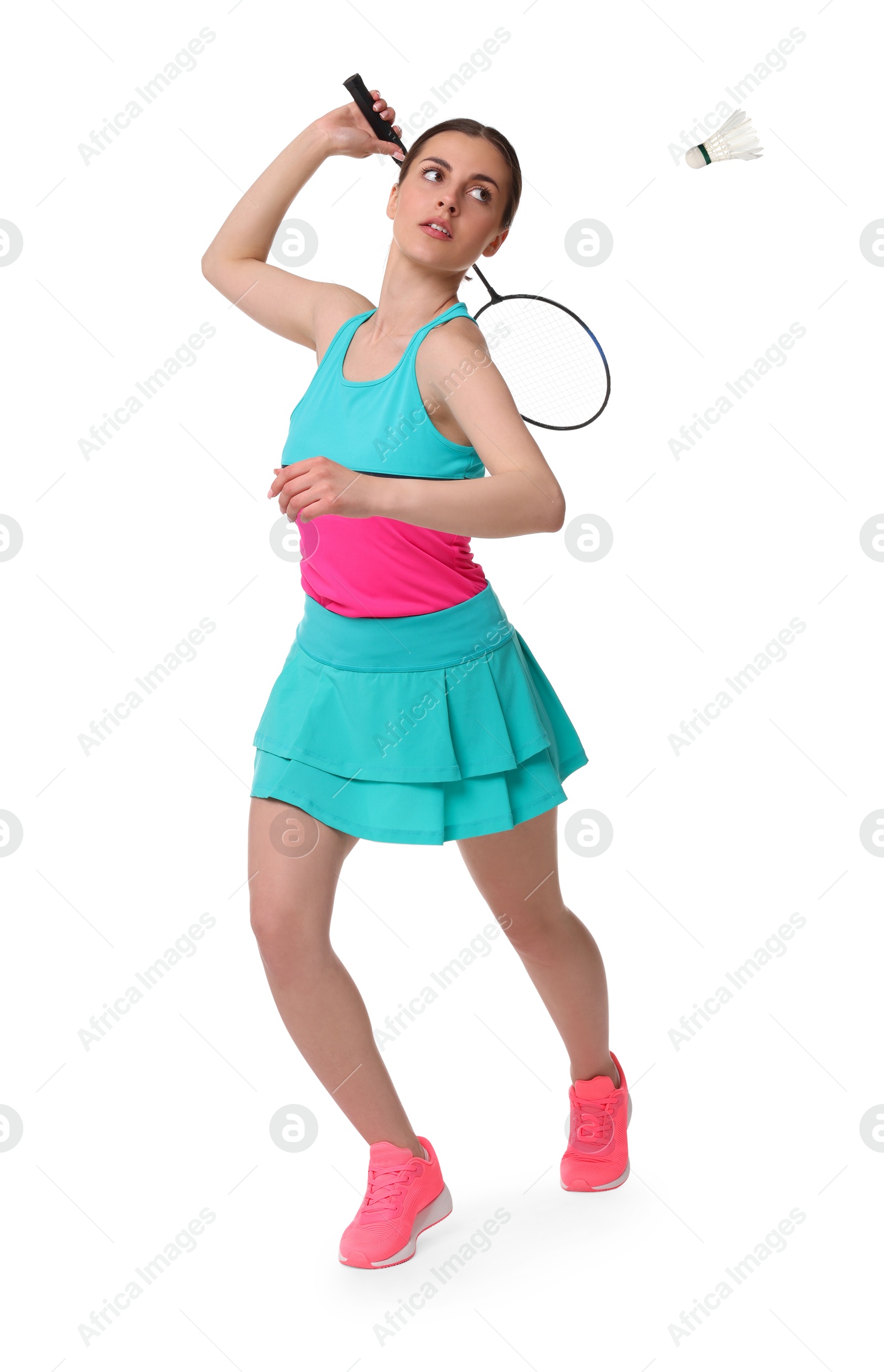 Image of Young woman playing badminton with racket and feather shuttlecock on white background