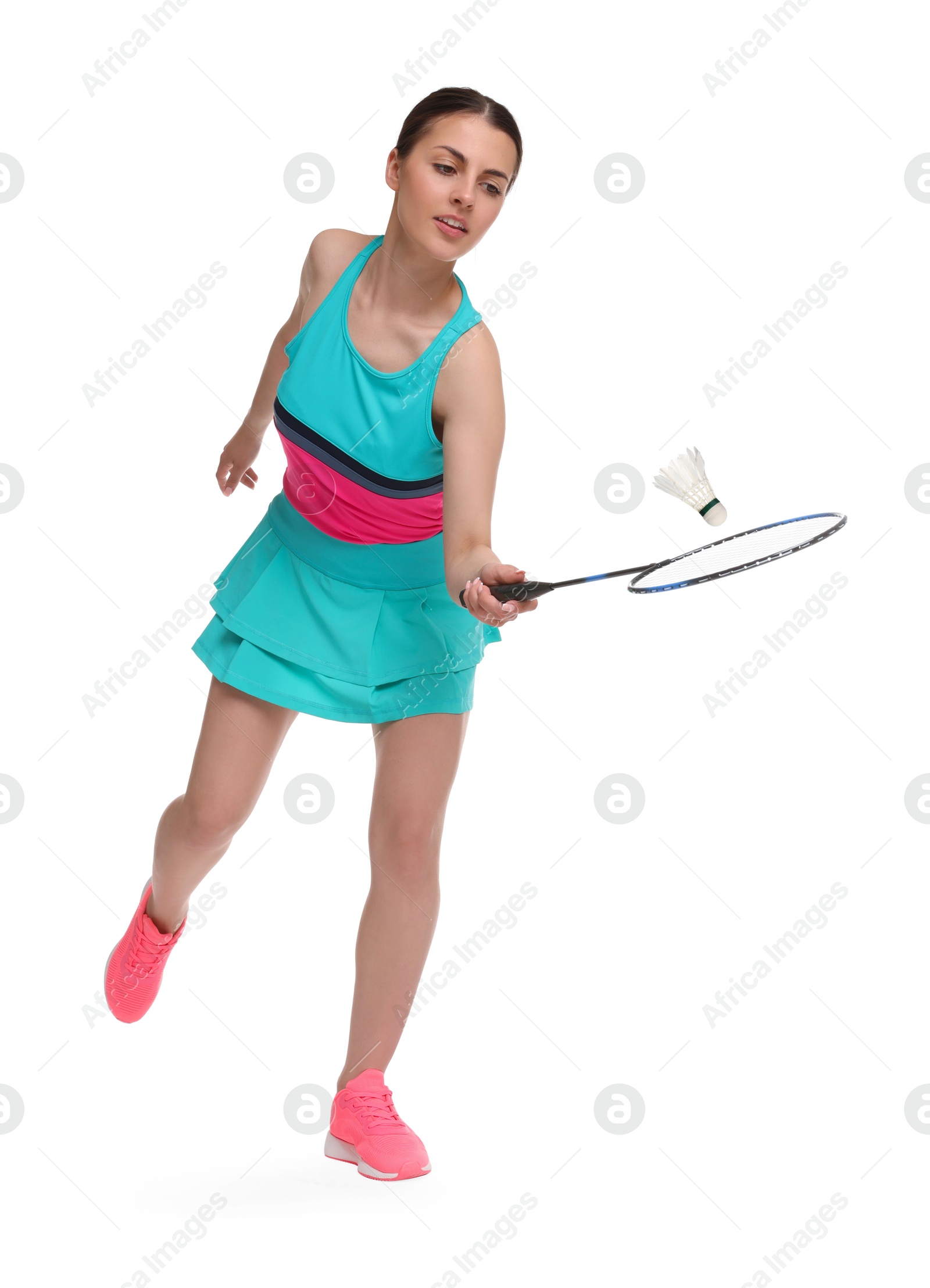 Image of Young woman playing badminton with racket and feather shuttlecock on white background