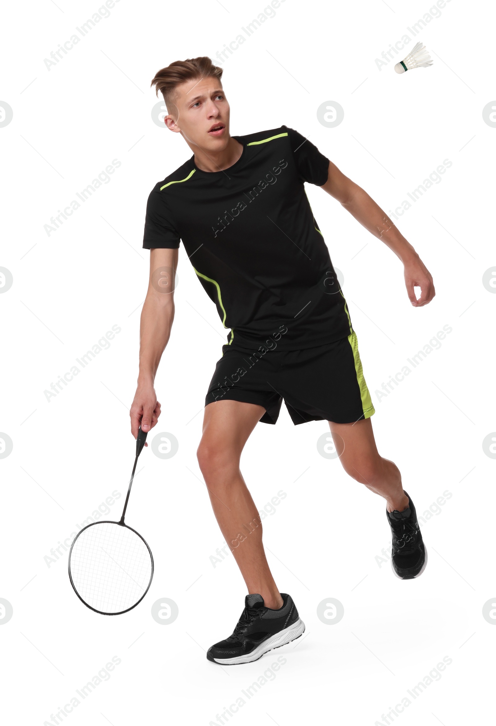 Image of Young man playing badminton with racket and feather shuttlecock on white background