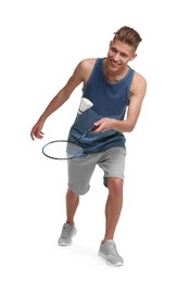 Image of Young man playing badminton with racket and feather shuttlecock on white background