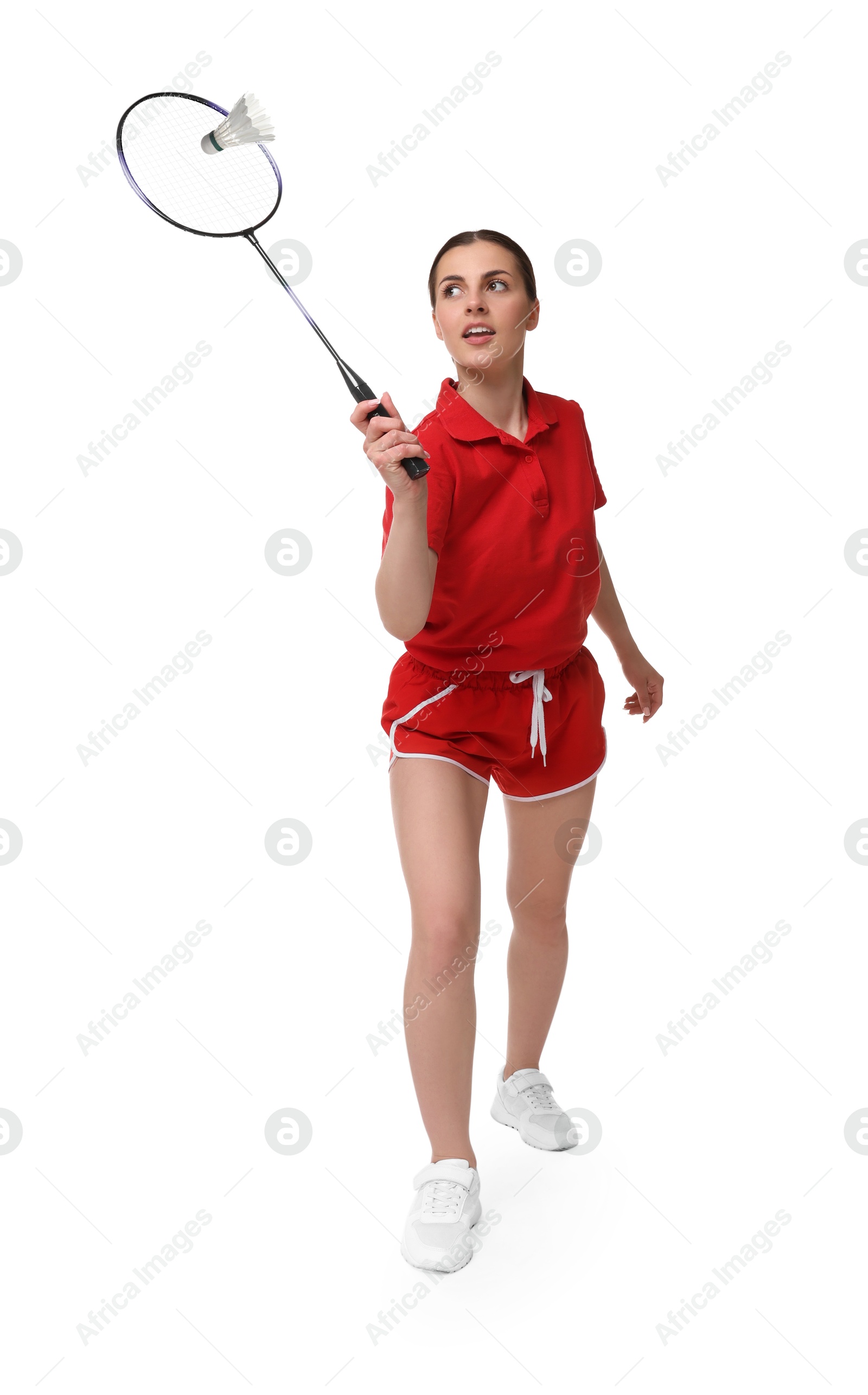 Image of Young woman playing badminton with racket and feather shuttlecock on white background