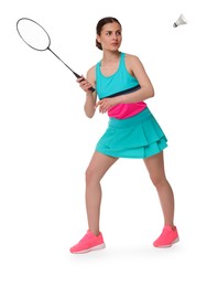 Young woman playing badminton with racket and feather shuttlecock on white background