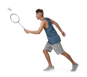 Image of Young man playing badminton with racket and feather shuttlecock on white background