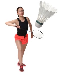 Image of Young woman playing badminton with racket and feather shuttlecock on white background