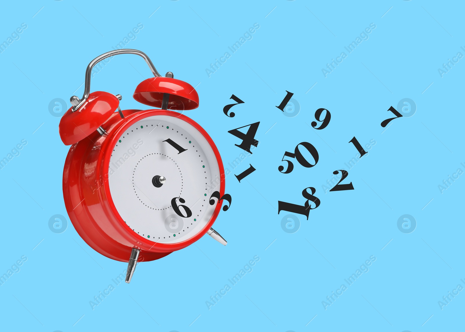 Image of Numbers flying away from alarm clock on light blue background. Time related concepts