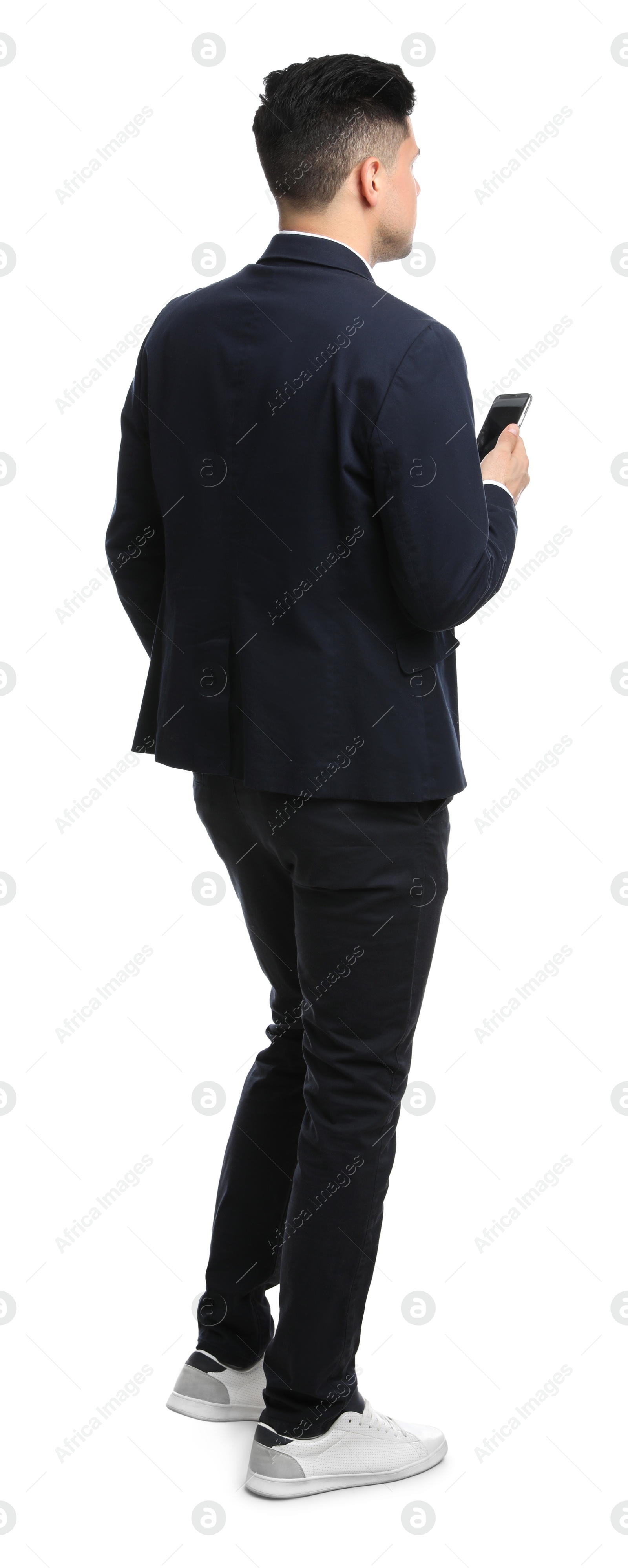 Photo of Businessman with smartphone on white background, back view