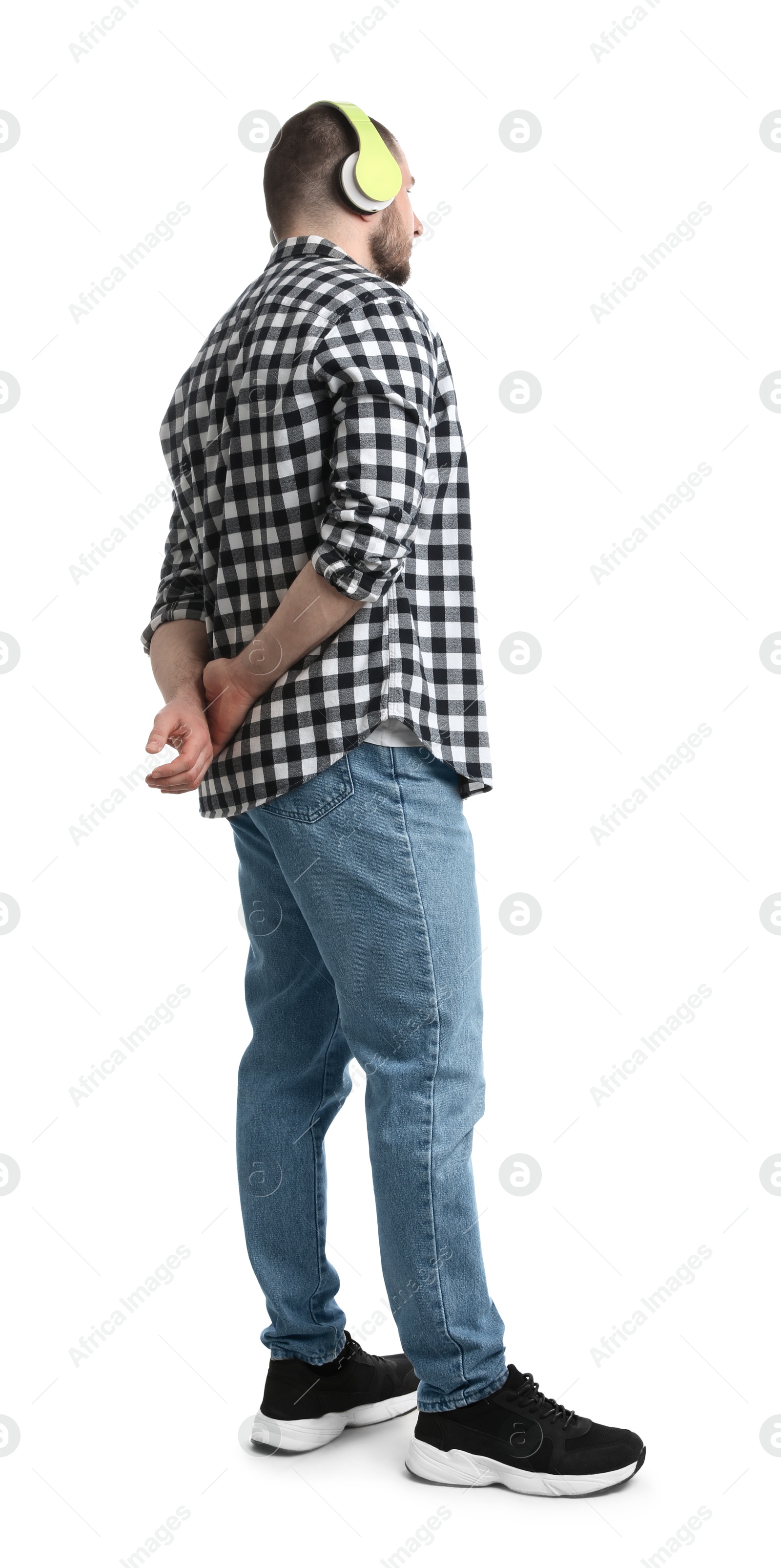 Photo of Man in casual clothes with headphones on white background