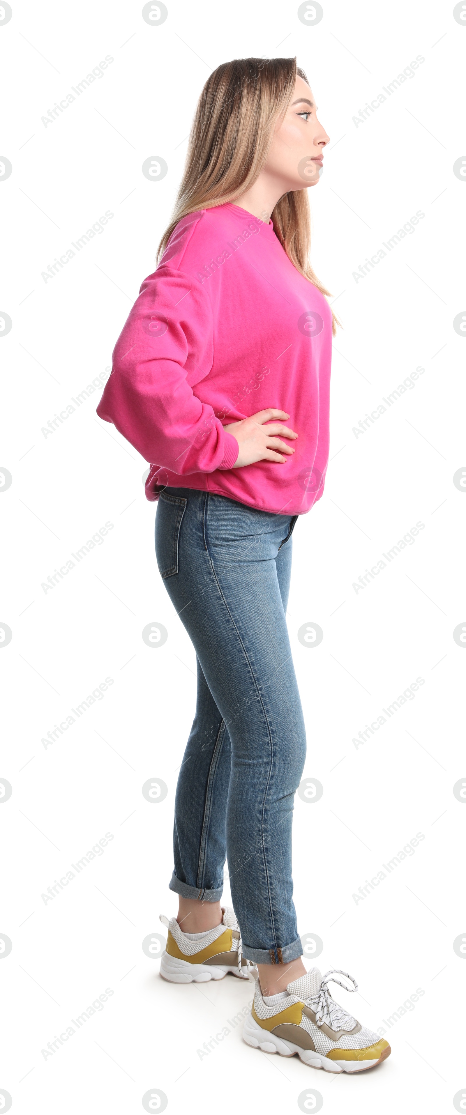 Photo of Young woman in casual outfit on white background