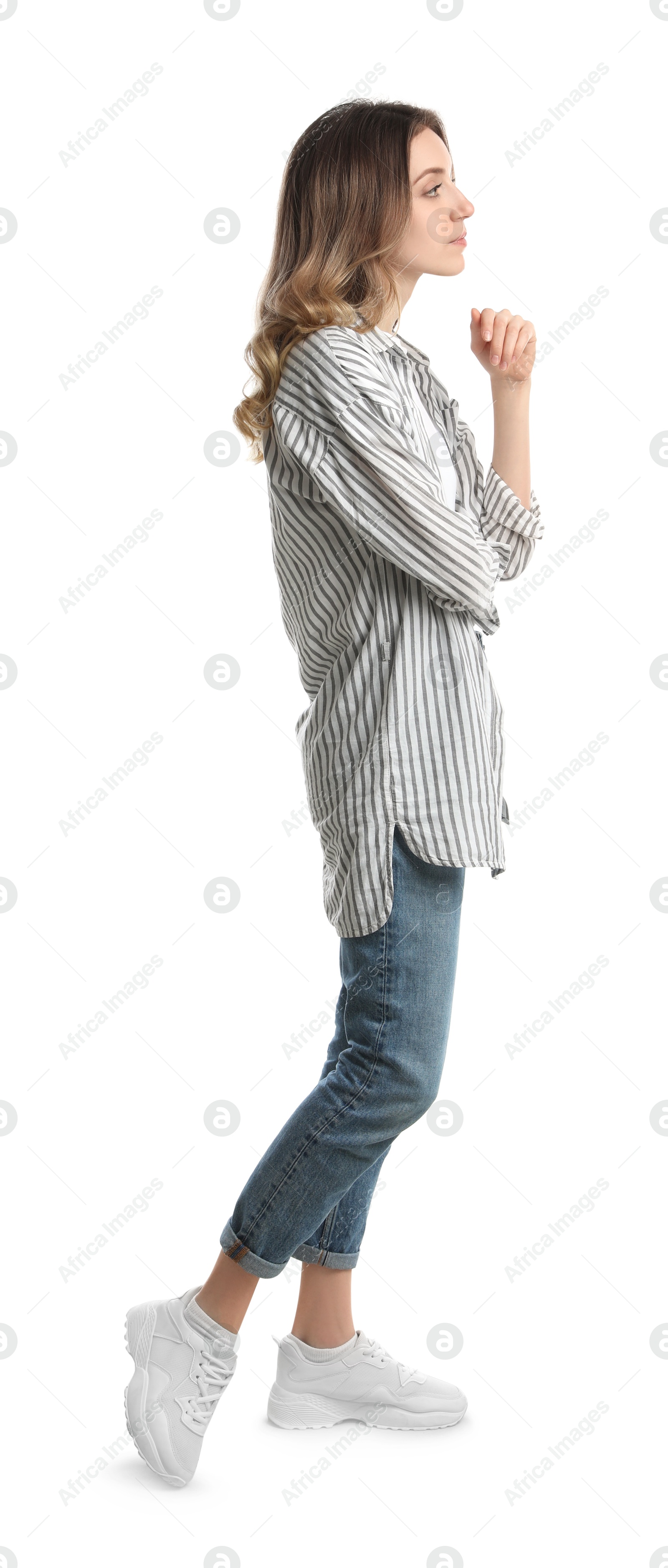 Photo of Young woman in casual outfit on white background