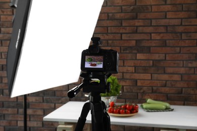 Photo of Shooting food in photo studio with professional lighting equipment