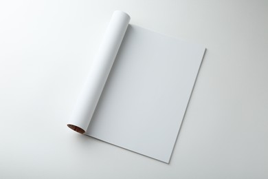 Photo of Open magazine with blank page on white background, top view. Mockup for design