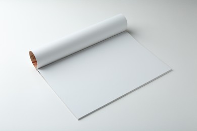 Open magazine with blank page on white background. Mockup for design