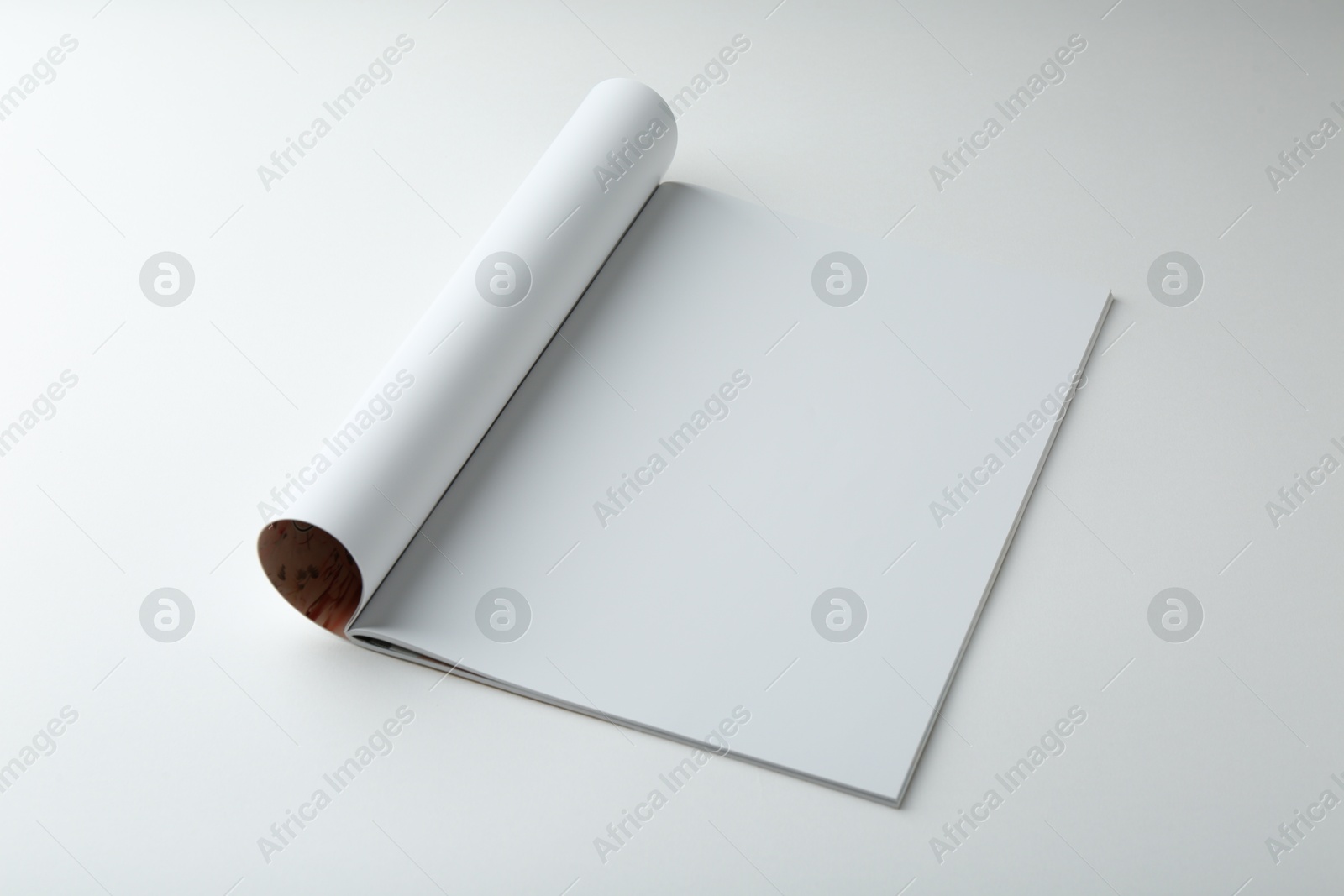 Photo of Open magazine with blank page on white background. Mockup for design