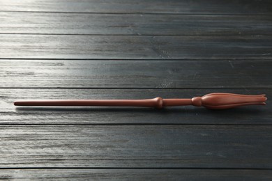 Photo of One old magic wand on wooden table