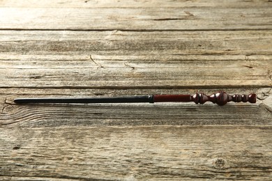 One old magic wand on wooden table