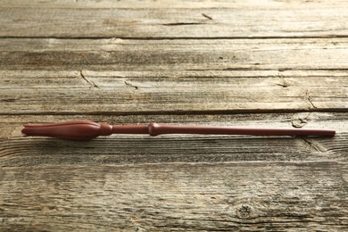 One old magic wand on wooden table