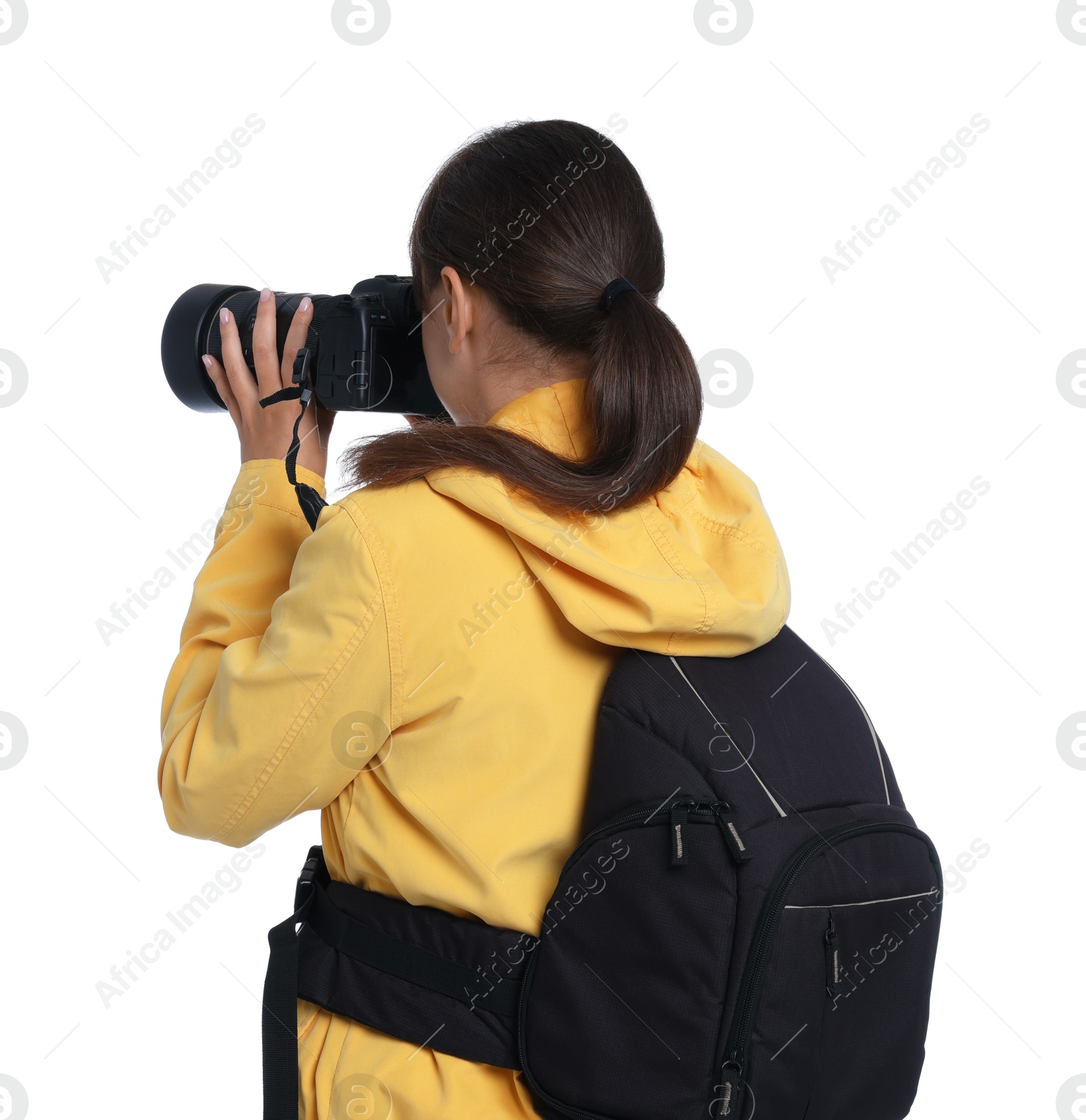 Photo of Photographer with backpack and camera taking picture on white background