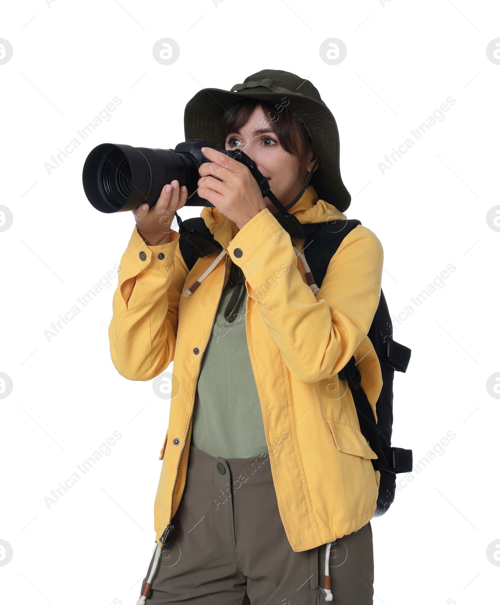 Photo of Photographer with backpack and camera taking picture on white background