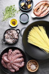 Photo of Ingredients for wok on grey table, flat lay