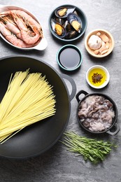 Photo of Ingredients for wok on grey table, flat lay