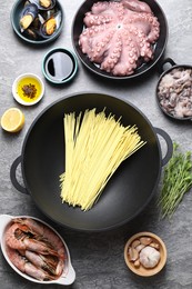 Photo of Ingredients for wok on grey table, flat lay