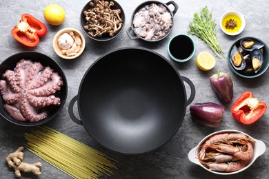 Photo of Ingredients for wok on grey table, flat lay