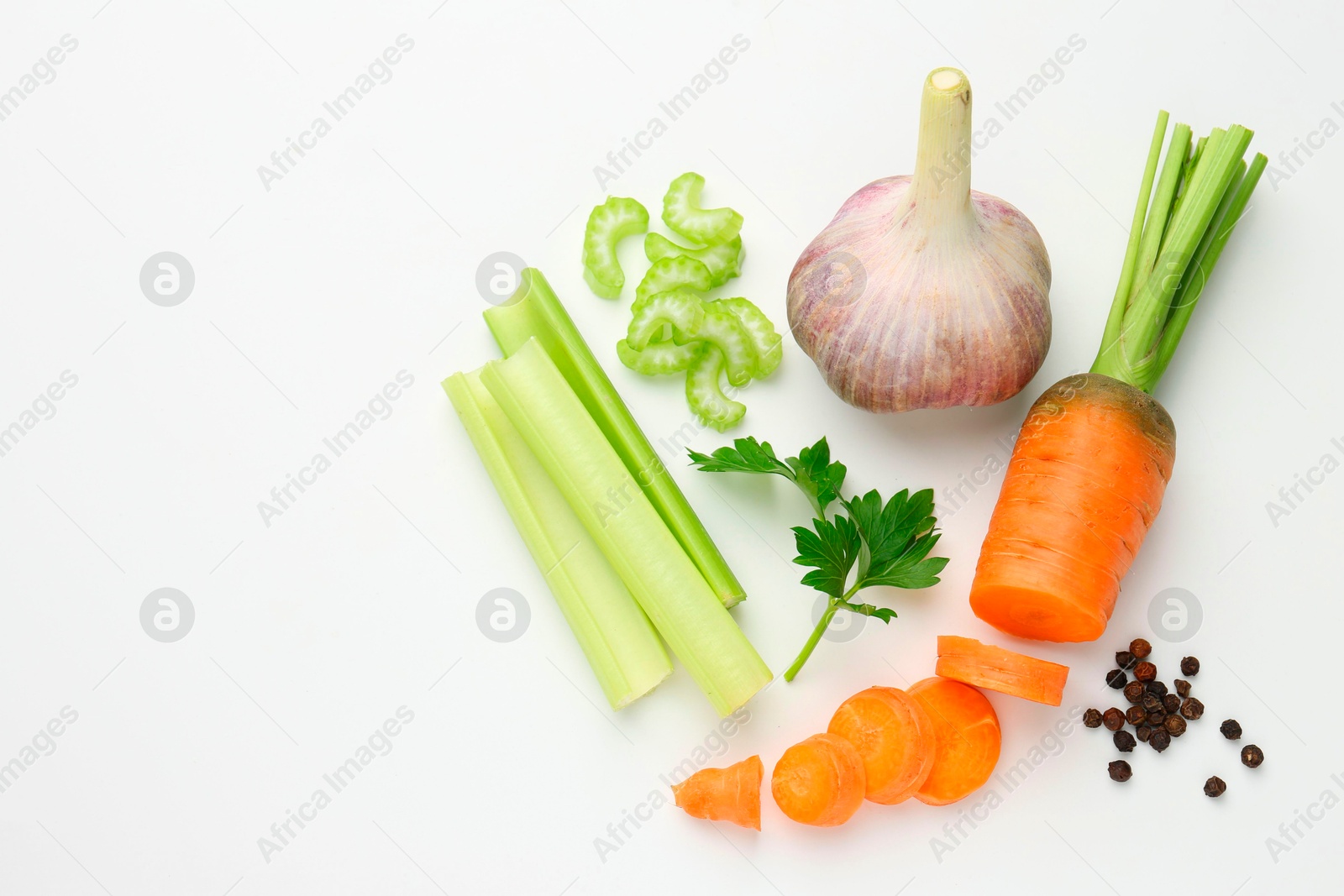 Photo of Fresh ripe carrot, vegetables and spices on white background, flat lay. Space for text