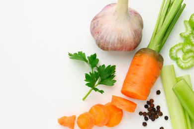 Photo of Fresh ripe carrot, vegetables and spices on white background, flat lay. Space for text