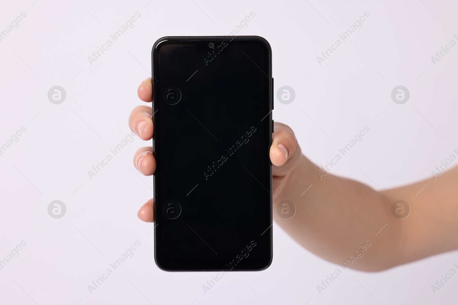 Photo of Woman holding smartphone with blank screen on white background, closeup