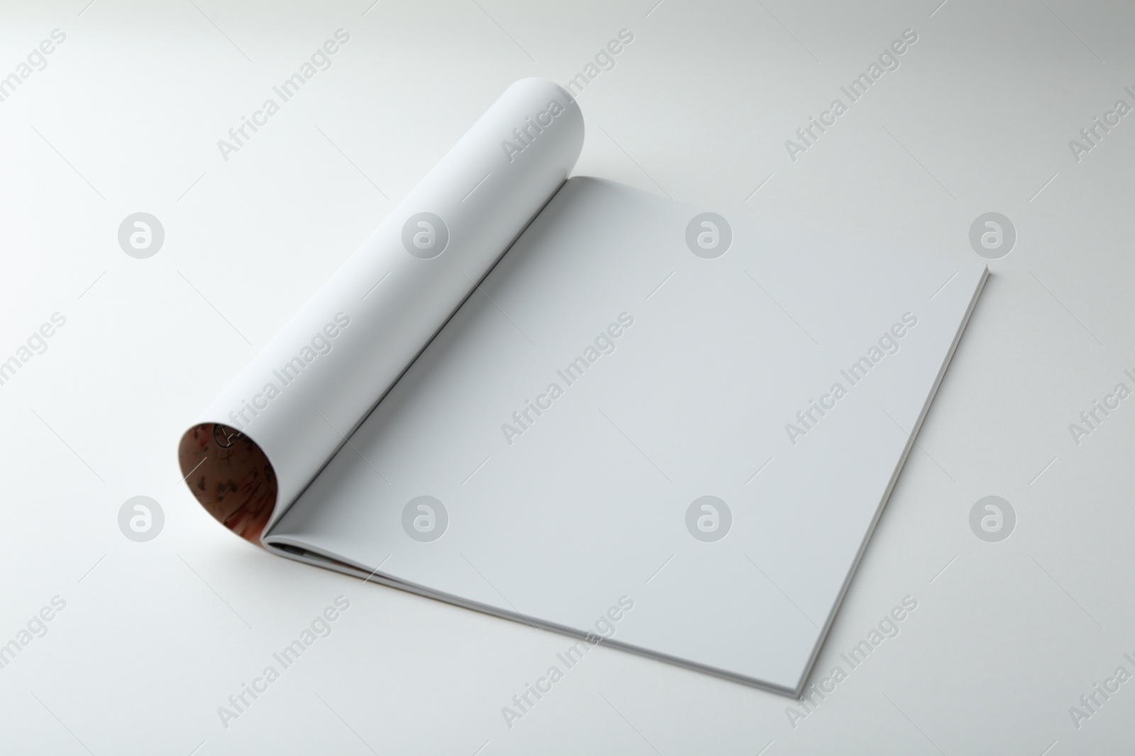 Photo of Open magazine with blank page on white background. Mockup for design