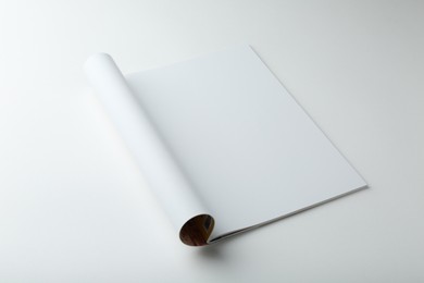 Photo of Open magazine with blank page on white background. Mockup for design