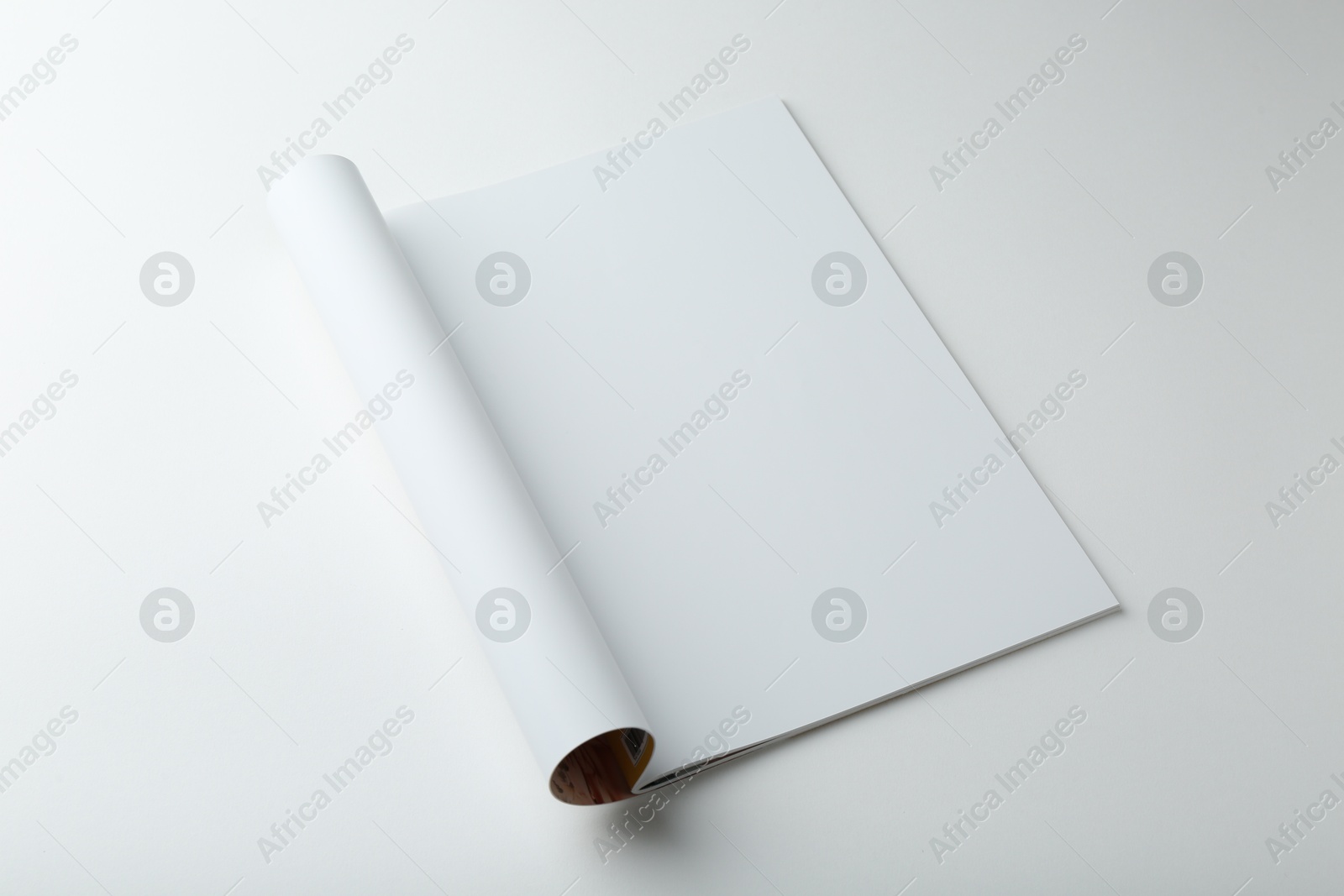 Photo of Open magazine with blank page on white background. Mockup for design