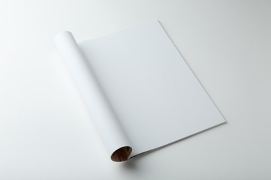 Photo of Open magazine with blank page on white background. Mockup for design