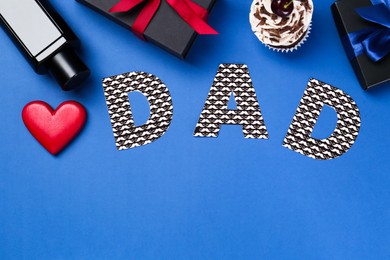 Happy Father's Day. Word Dad made of paper, decorative heart, perfume, gift boxes and cupcake on blue background, flat lay. Space for text