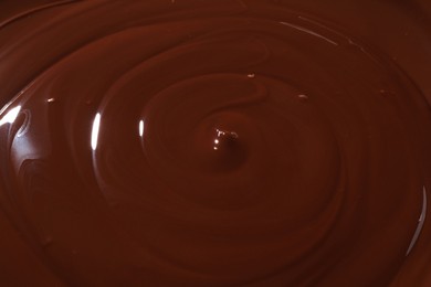 Tasty melted chocolate as background, closeup view