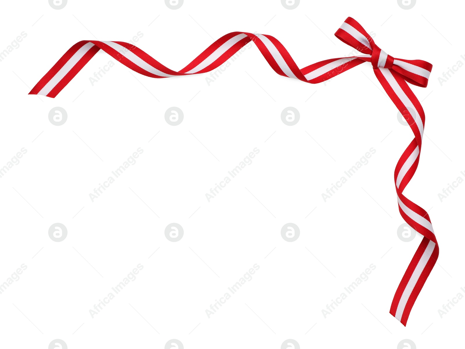 Photo of Ribbon with bow in colors of Austrian flag isolated on white