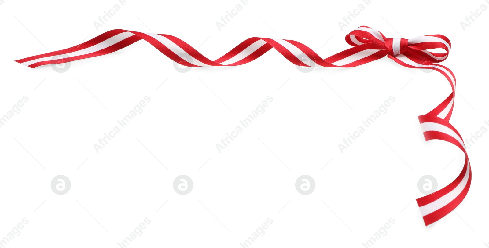 Photo of Ribbon with bow in colors of Austrian flag isolated on white