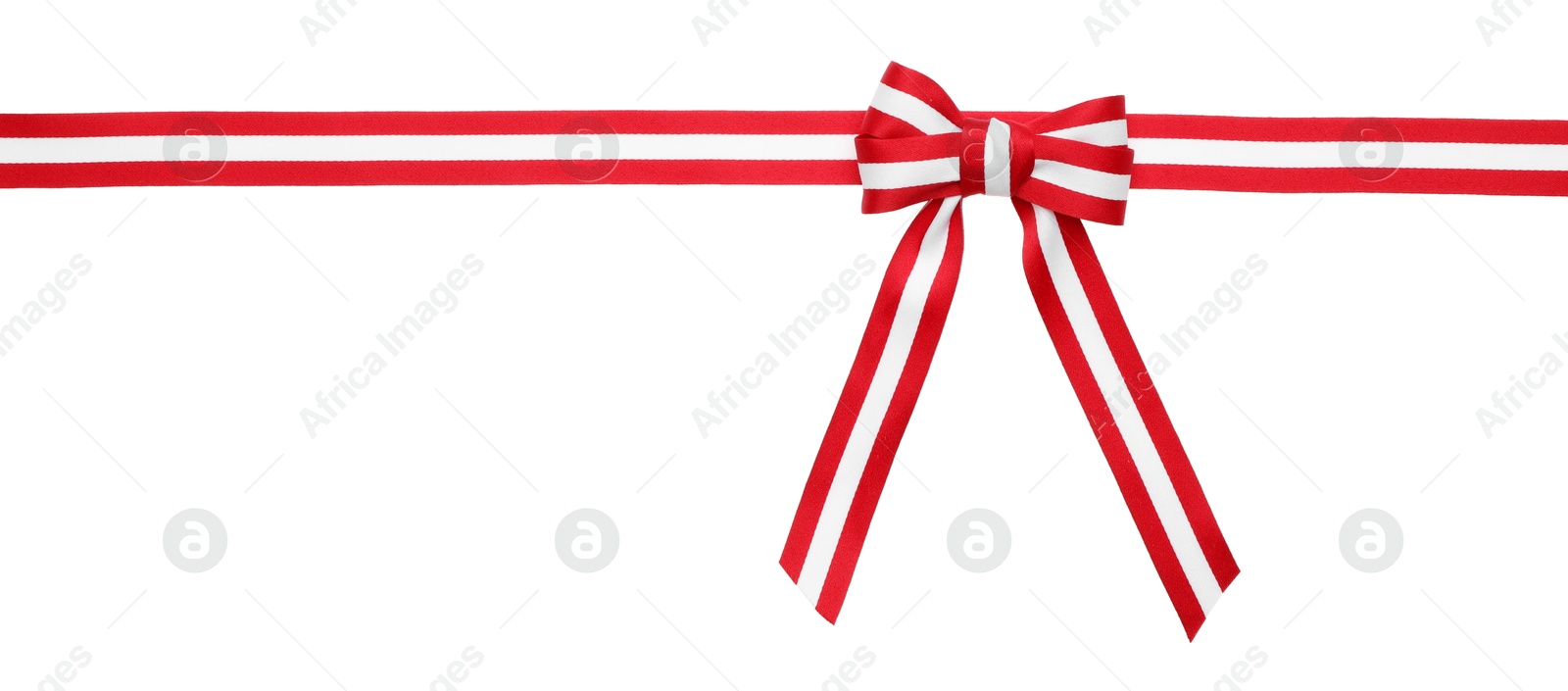 Photo of Ribbon with bow in colors of Austrian flag isolated on white