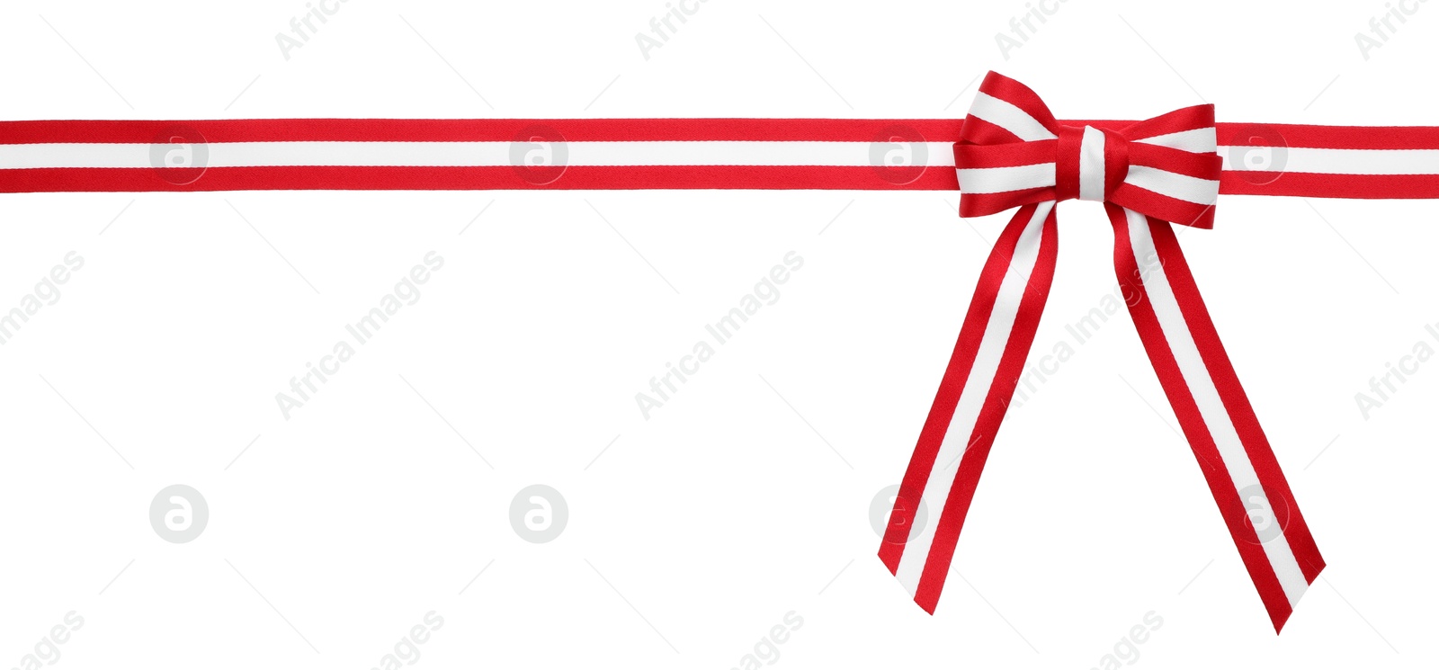 Photo of Ribbon with bow in colors of Austrian flag isolated on white