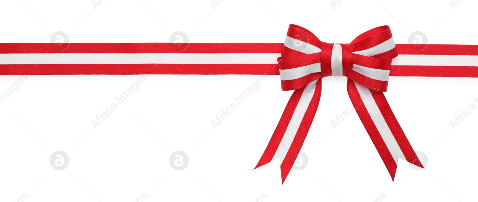 Photo of Ribbon with bow in colors of Austrian flag isolated on white