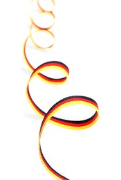 Photo of Ribbon in colors of German flag isolated on white