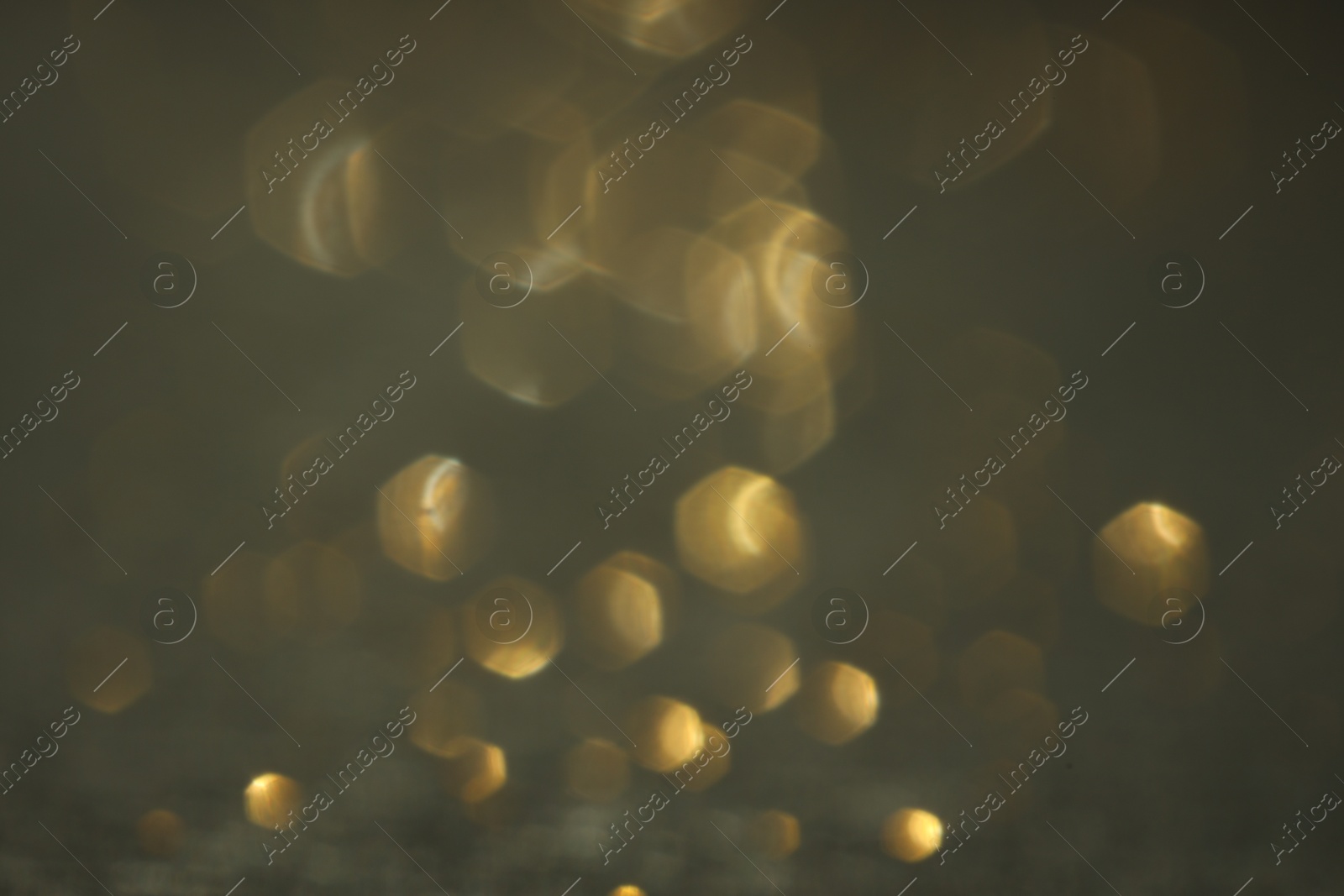 Photo of Beautiful shiny glitter on grey background, closeup