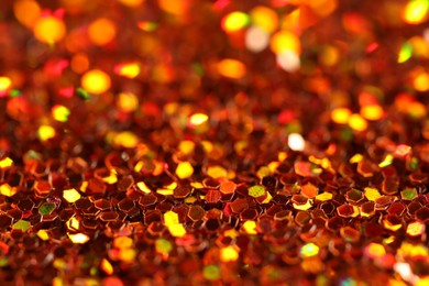 Beautiful shiny golden glitter as background, closeup